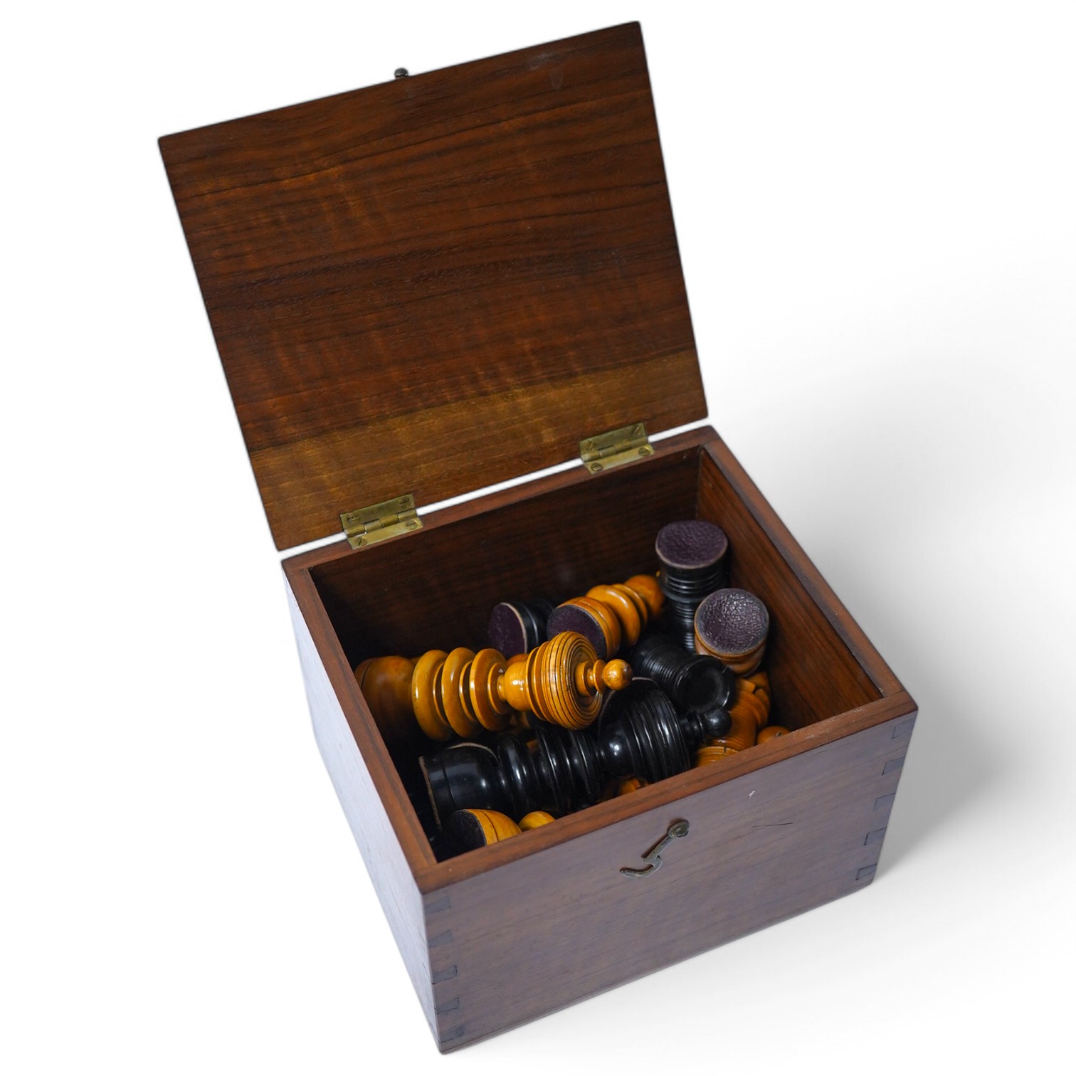 A turned wooden chess set in ebony and boxwood, king 10.5cm high, in a hardwood box. Condition - good.